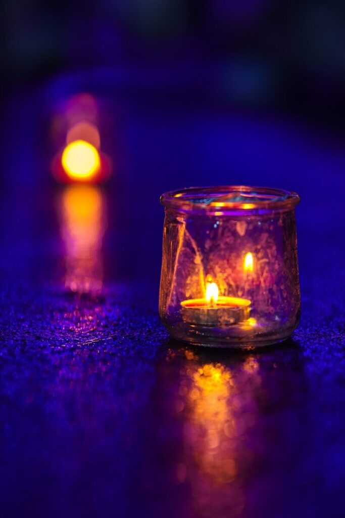 A couple of candles that are on a table
